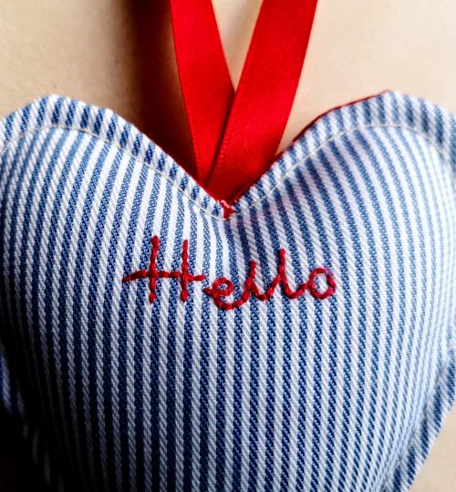 Hanging heart with embroidered word hello